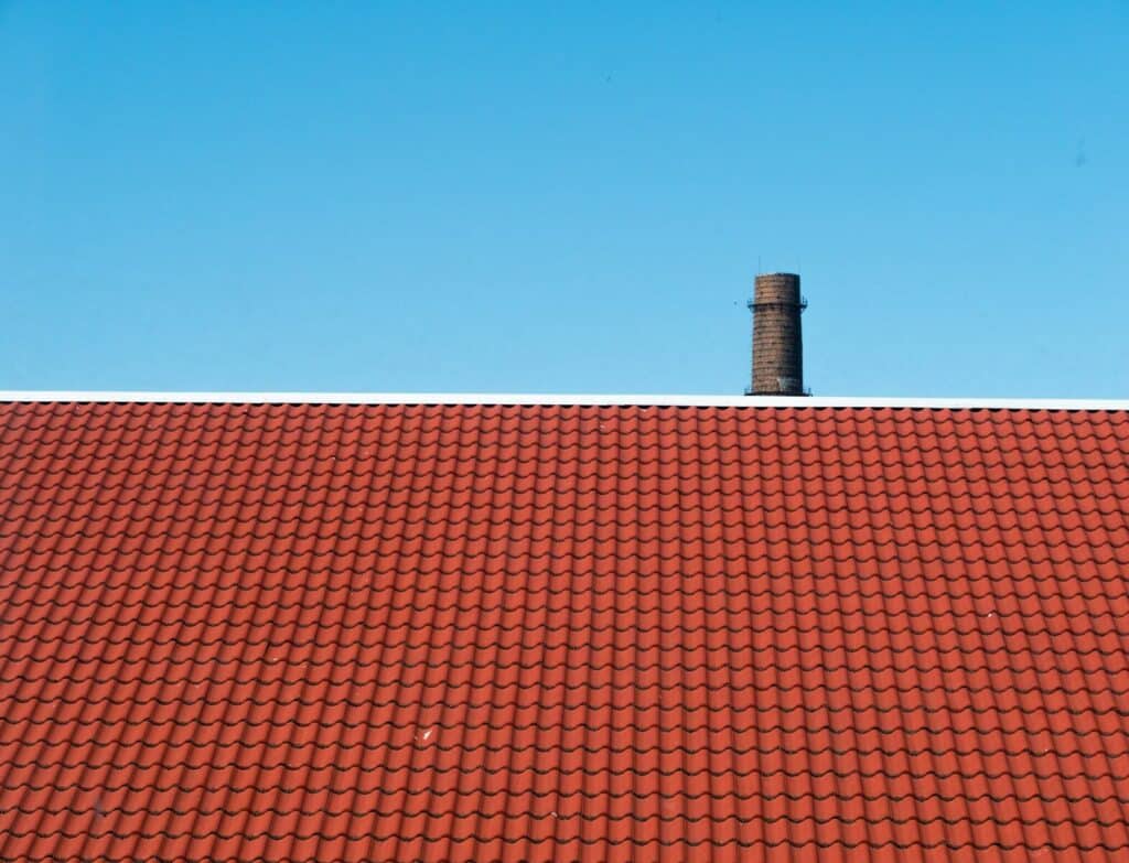 brown roof across blue sky for Roofing Contractor in Delray Beach
