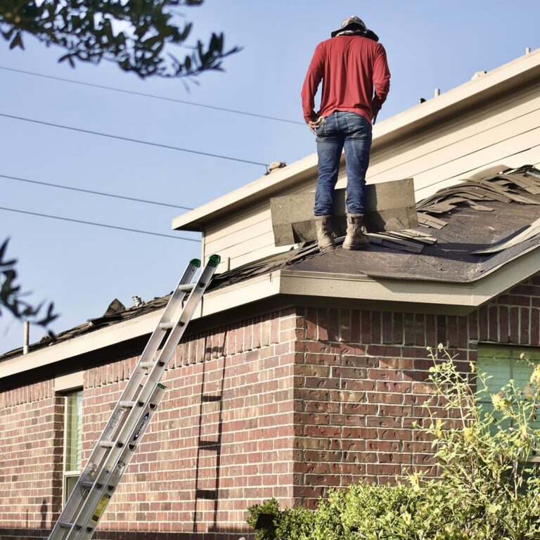 Roofing crew completing roofing work for a roofing contractor in Jensen Beach, FL