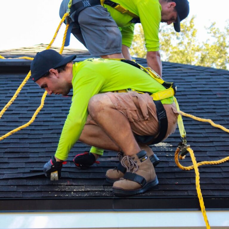 Roofing crew completing roofing work for a roofing contractor in Hobe Sound, FL
