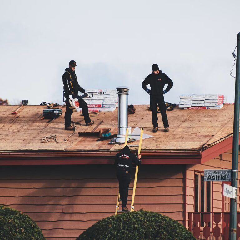 Roofing crew completing roofing work for a roofing contractor in Port St. Lucie, FL