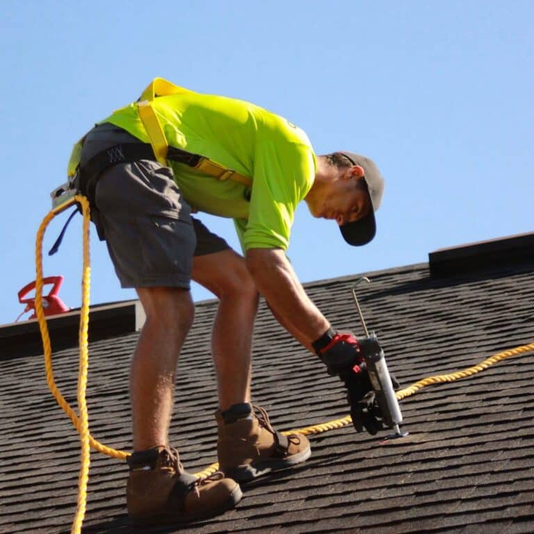 Roofing crew completing roofing work for a roofing contractor in Lakewood Park, FL